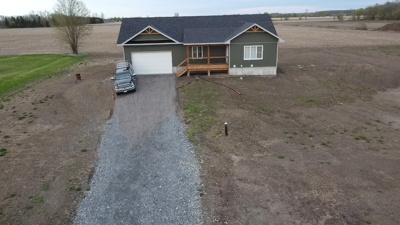Rural home with gravel driveway